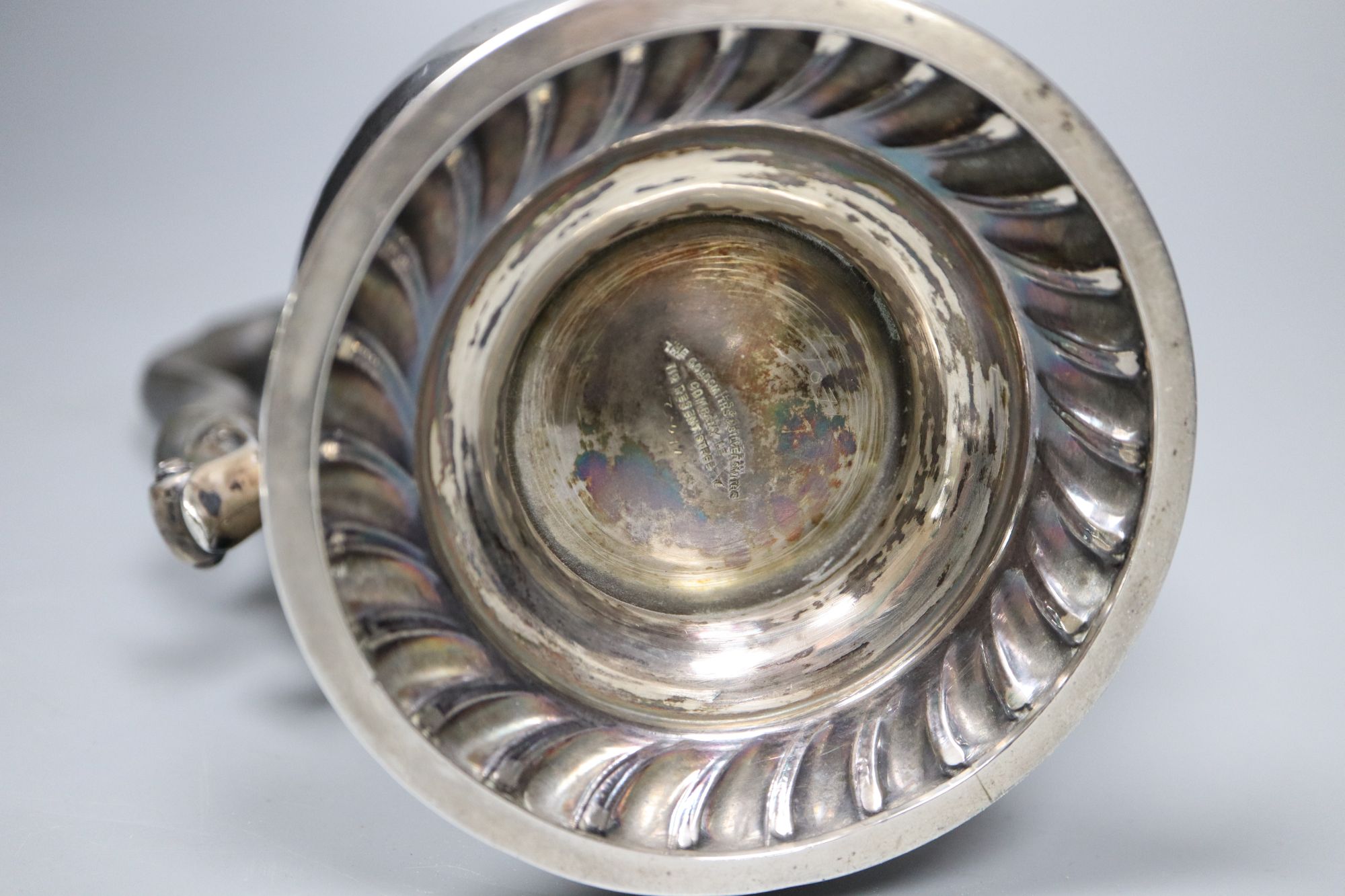 A George V silver baluster hot water pot, with ebonised handle, Goldsmiths & Silversmiths Co Ltd, London, 1927